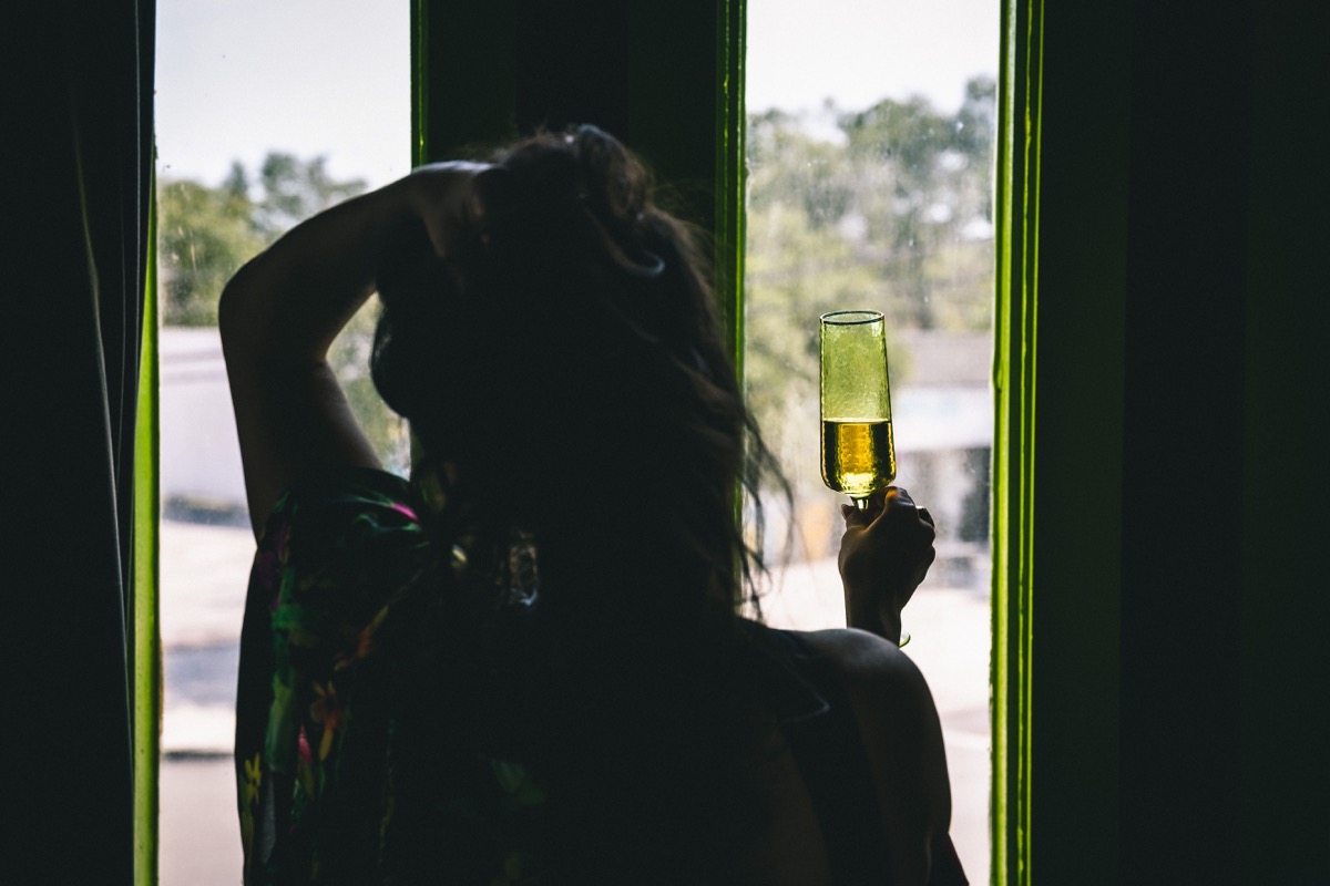 Katie raising a champagne glass